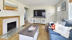 Living room with comfortable seating and flat screen TV