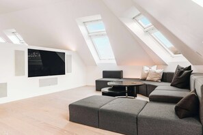 The perfect spot for relaxation and entertainment, featuring a high-quality TV.