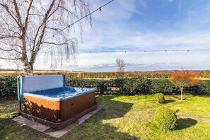 Soak in serenity, let the warm waters of the hot tub melt away your stress, surrounded by peaceful nature