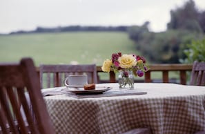 Surrounded by green space, relax and enjoy a cup of tea on the decking