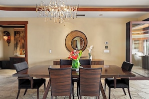 Host memorable meals in the elegant dining room with table for six, refined finishes and tropical flair.