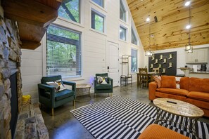 Bold design meets cozy vibes! Lounge on the plush sectional, snap pics by the record wall, or chill by the fire. This stylish cabin is made for unforgettable hangs.