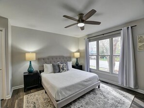 Another view of the primary bedroom, showcasing its cozy ambiance and ample space.