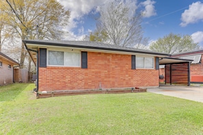 House Exterior | Fenced Backyard | Charcoal Grill