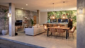 Living room, dining room and kitchen by night.