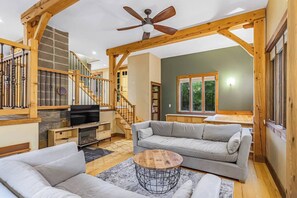 Step into our spacious living room, where comfort and style come together effortlessly. Sink into plush Restoration Hardware velour sofas and unwind by the cozy electric fireplace. Whether you're streaming your favorite shows on the smart TV or enjoying a quiet evening in, this space is perfect for relaxing. French doors open directly to the fenced backyard and deck, creating a...