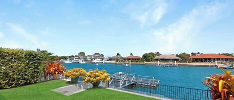 Serenity awaits—enjoy breathtaking lake views from our cozy covered terrace, the perfect spot to unwind!"