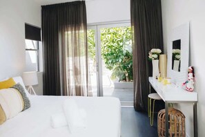 The second bedroom includes a queen bed and relaxed styling, perfect for unwinding after a day exploring the coast.