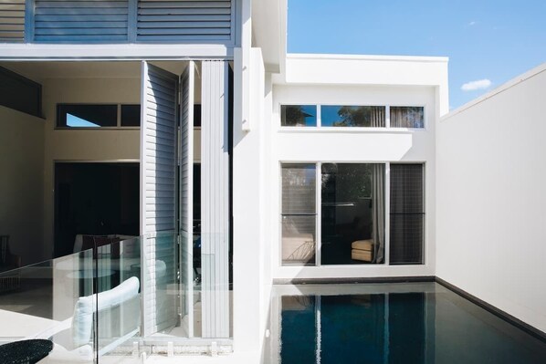 The private pool area is perfect for sun-drenched days, with loungers for lazing.