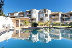Take a dip in the shared pool, offering a relaxing swim no matter the season—just steps from your front door.