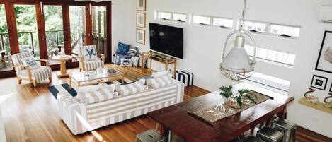 The open-plan design seamlessly connects the dining area to the living space.
