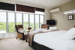 Enjoy leafy outlooks from the air-conditioned primary bedroom.