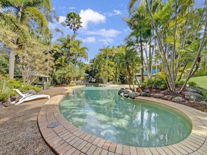 Spend your days lazing by the resort pool.