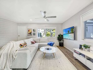 A large L-shaped lounge invites you to cosy up with a movie or your favourite TV show.
