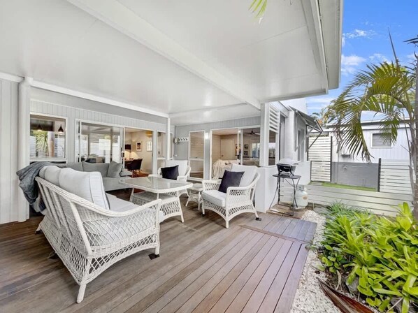 The spacious, undercover deck offers relaxed alfresco dining with a BBQ grill.