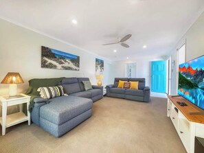 The lounge room offers ample seating for your whole group to come together for movie night.