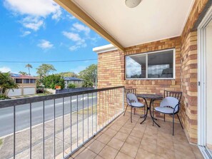Start your mornings with coffee and fresh air on the breezy balcony, set with a bistro table and leafy street views.