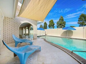 Relax by the pool in the sun lounges