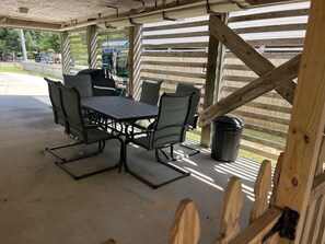 Outside covered patio, great space for enjoying crabs or just grilling out