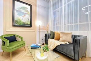 Elevate your stay with designer chic in this apartment. Immerse yourself in the allure of tall ceilings, artisan-restored moldings and designer finishes.