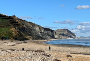 Scenic Charmouth Beach with its Jurassic cliffs and peaceful shoreline