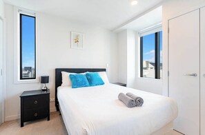 Bedroom 1, Queen bed, En-suite bathroom, Nightstand, wardrobe.