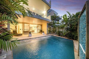 The beautiful pool area is ideal for refreshing daytime dips and relaxing sunset swims.