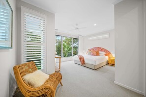 Spacious master bedroom with private ensuite and tranquil leafy views
