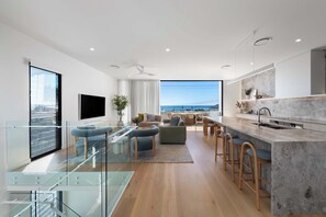 Come home to space and comfort with an open-plan living complemented by floor-to-ceiling views and stylish furnishings. This three storey home has the added feature of a lift as well to access each floor.