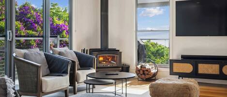 Relax fireside in the spacious living area with a good book or stream a movie on the 65" Smart TV.