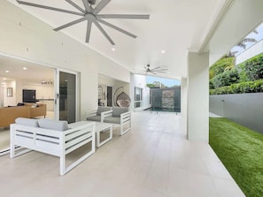 Charming patio with ample space and a poolside view.