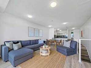 The living area is located upstairs, accessed via a staircase.