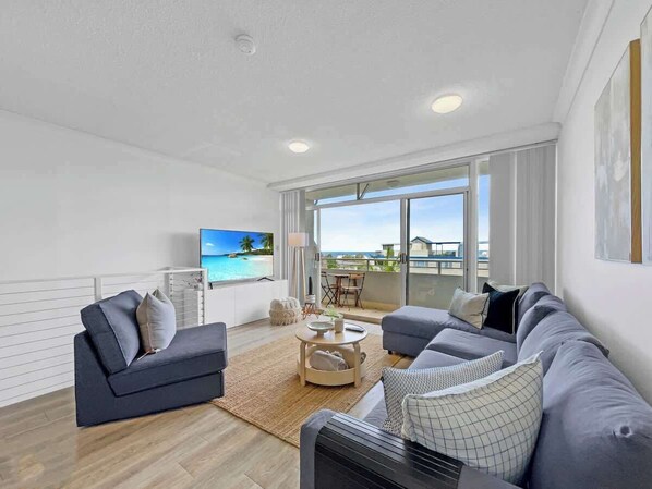 The living area welcomes you with an L-shaped lounge and breeze open layout.