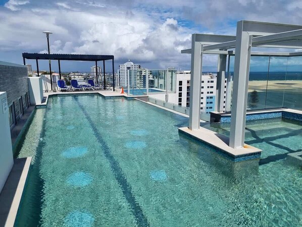 Sunset soaks and sunrise swims await in the luxurious, shared rooftop pool and spa.