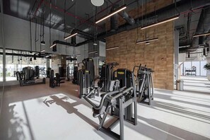 Spacious gym with everything you need, plenty of machines for a full-body workout, plus a large yoga and stretching area in the back !