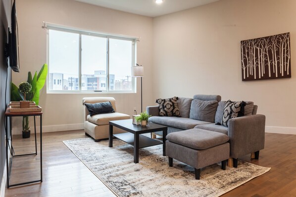 Indulge your senses in our living room's lively and colorful ambiance, creating a vibrant space for relaxation and socializing. #CozyRetreat