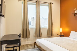 Experience modern elegance in our carefully curated bedroom. The tasteful decor, paired with soft lighting, creates a serene atmosphere for a restful night's sleep. #ElegantDesign #BedroomComfort #SereneSpace