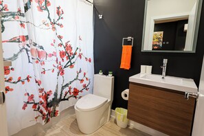 A sleek and spotless bathroom designed for your daily rituals. Fresh towels, essentials, and calming vibes included — because you deserve to start and end your day refreshed.