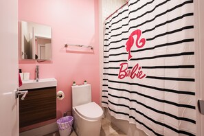 A sleek and spotless bathroom designed for your daily rituals. Fresh towels, essentials, and calming vibes included — because you deserve to start and end your day refreshed.