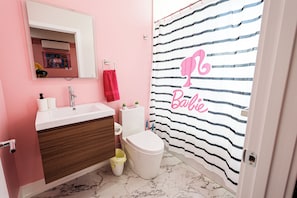 A sleek and spotless bathroom designed for your daily rituals. Fresh towels, essentials, and calming vibes included — because you deserve to start and end your day refreshed.