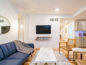 Experience the perfect blend of style and comfort in our living room, with its colorful vibe that adds a lively touch to your stay. #LivingRoom /