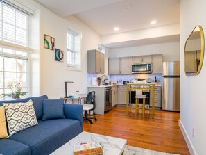 Enjoy the freedom of an open kitchen with a connected living room, creating a welcoming atmosphere for shared meals and conversations. #OnestopComfort.