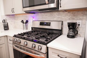 Step into our fully-equipped and modern kitchen, where culinary delights await! This stylish space combines functionality with contemporary design, providing everything you need for a seamless cooking and dining experience.