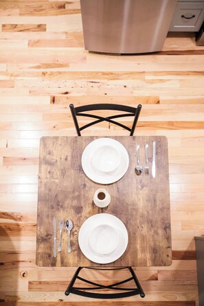 Gather around our exquisite dining table, where every meal is an invitation to savor the joy of shared moments and delectable flavors. Crafted with timeless elegance, the table stands as a centerpiece, adorned with a polished surface that reflects the warmth of ambient lighting. Whether hosting intimate dinners or festive gatherings, this dining table embodies both functionalit...