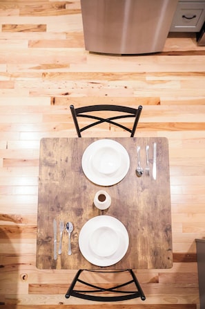 Gather around our exquisite dining table, where every meal is an invitation to savor the joy of shared moments and delectable flavors. Crafted with timeless elegance, the table stands as a centerpiece, adorned with a polished surface that reflects the warmth of ambient lighting. Whether hosting intimate dinners or festive gatherings, this dining table embodies both functionalit...