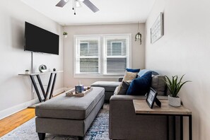 Living Room 2- Unit 2 - Cozy & Inviting – Relax in this stylish and comfortable living space.
