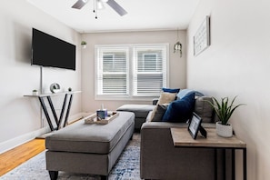 Living Room 2- Unit 2 - Cozy & Inviting – Relax in this stylish and comfortable living space.