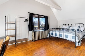 Bedroom 3 - Unit 2 - Sleep in Comfort – Spacious queen bed with plush pillows.