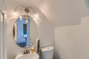 Modern 1st floor powder half bath.
