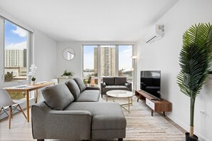 An open Living room setup connect with the dining area, inviting gatherings around both delicious meals and delightful conversations